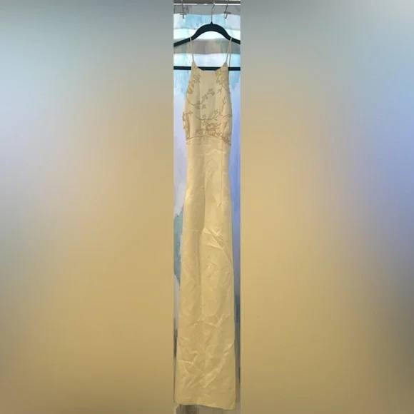 Ivory/cream dress with spaghetti straps and a zipper in the back. Gently used. - Picture 2 of 11